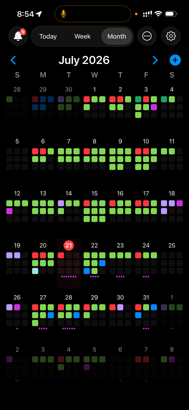 The Month view — a busy grid color-coded by how full each day is